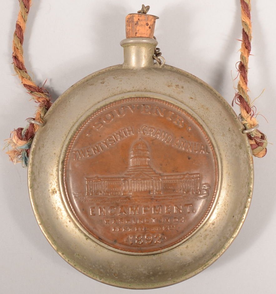 GAR Souvenir Canteen 26th Grand Annual Encampment.: GAR Souvenir Canteen 26th Grand Annual Encampment. Washington D.C., Sept. 20 -23 1892. Nickel plated tin canteen with embossed copper medallions on both sides. Hanging rings on sides with twisted red,