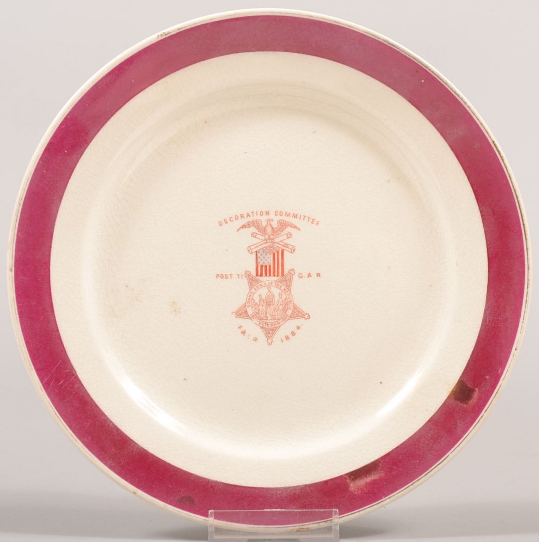 GAR Ironstone Dinner Plate. Purple rim band on whi: GAR Ironstone Dinner Plate. Purple rim band on white plate with transfer of members medal on center with: "Decoration Committee, Post 71, G.A.R. Fair, 1884." 8"dia. Condition: Good with one chip off u