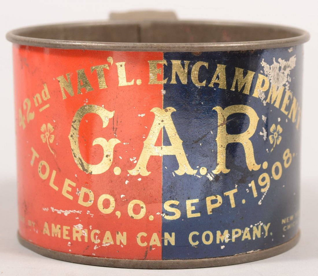 A Painted Tin Cup fron the 42nd National GAR Reuni: A Painted Tin Cup fron the 42nd National GAR Reunion. Red and blue screen printed label over a tin plated steel cup with loop handle. Encampment held at Toledo, Ohio, Sept. 1908. The cup also labeled