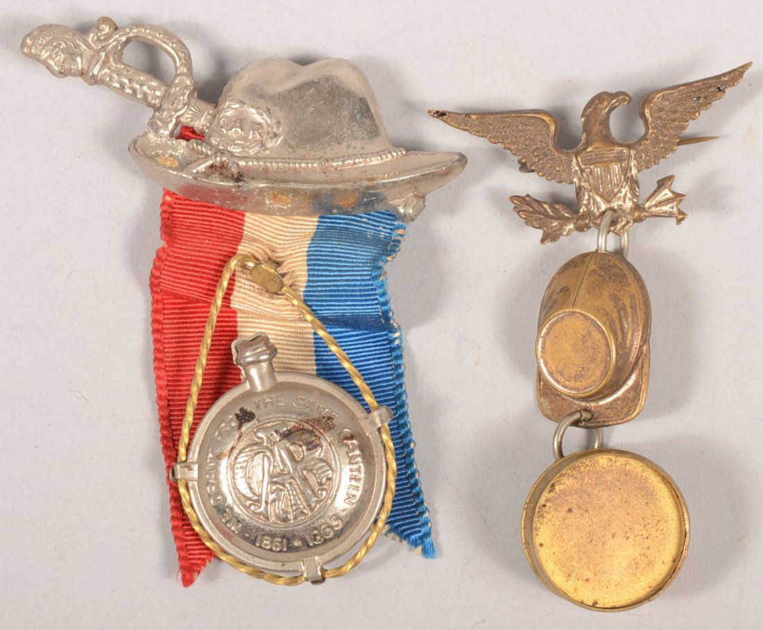 Two Non-Descript GAR Souvenir Pinback Badges. A p: Two Non-Descript GAR Souvenir Pinback Badges. A plated cast brass GAR sword and campagin hat pinback with a red, white and blue ribbon having a canteen stapled to it's middle. 2 3/4"l. Together with a