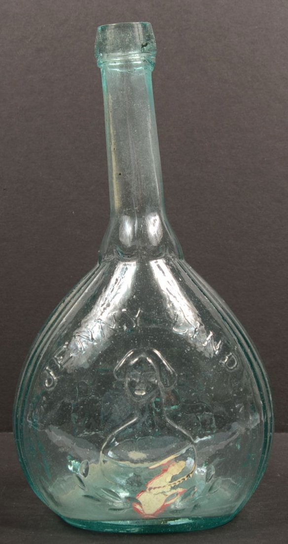 Mold Blown Calabash Flask of Fislerville Glass Wor: Mold Blown Calabash Flask of Fislerville Glass Works. Southern New Jersey made aquamarine glass bottle shows the "Works" obverse and "Jenny Lind" with bust of same reverse. Bottle has a long neck, app