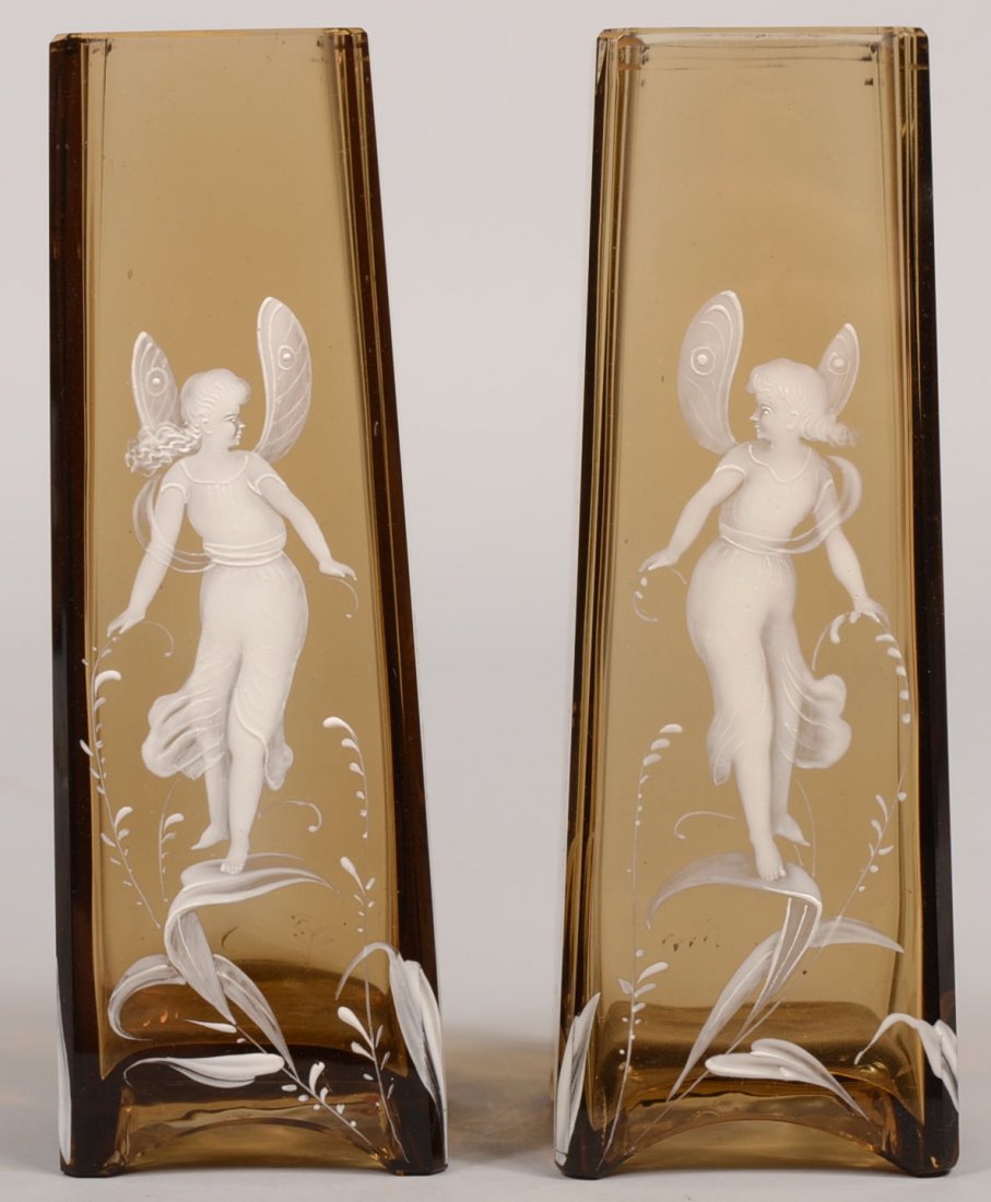 Pair of Mary Gregory Tapered Amber Glass Vases. Sq: Pair of Mary Gregory Tapered Amber Glass Vases. Square and tapered vases with winged fairies standing on leaves having a gold rim and arched base. 6 7/8"h. Condition: Good, no damage.