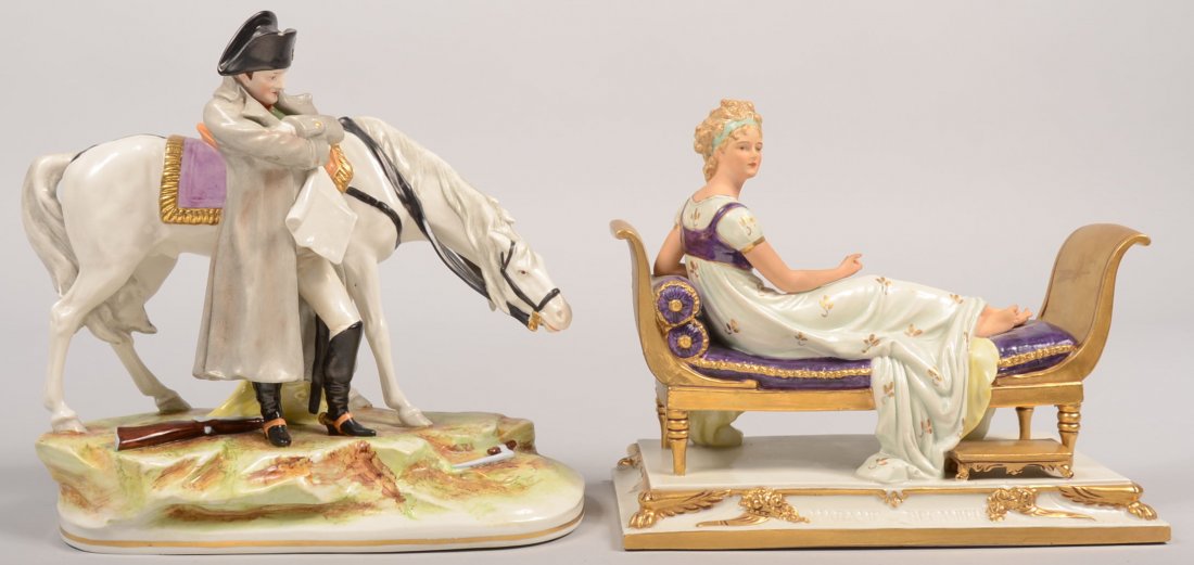 Two German Hand Painted Porcelain Figurines. First: Two German Hand Painted Porcelain Figurines. First depicting Napolean Standing by his horse with broken musket at his feet, 8 3/4"h., second is a figure of a woman reclining on a settee, impressed mar