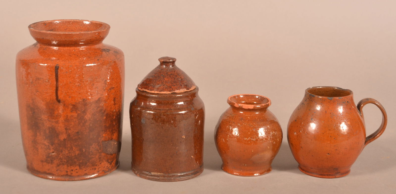 Four Antique Glazed Redware Storage Vessels. (1 of 2)