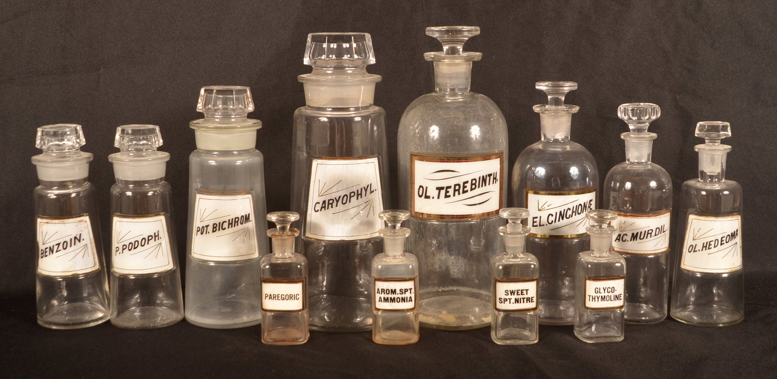 12 Antique Colorless Glass Apothecary Bottles. (1 of 6)