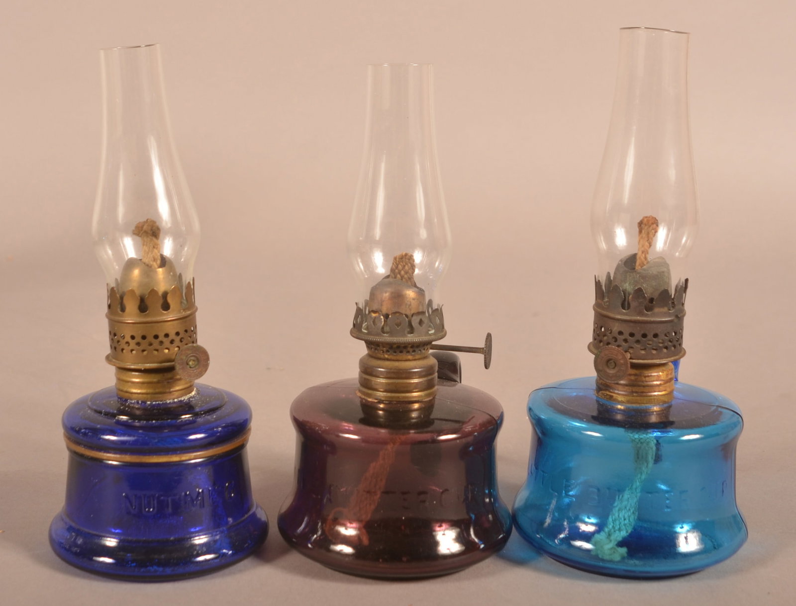 Three Antique Colored Glass Finger Lamps. (1 of 3)