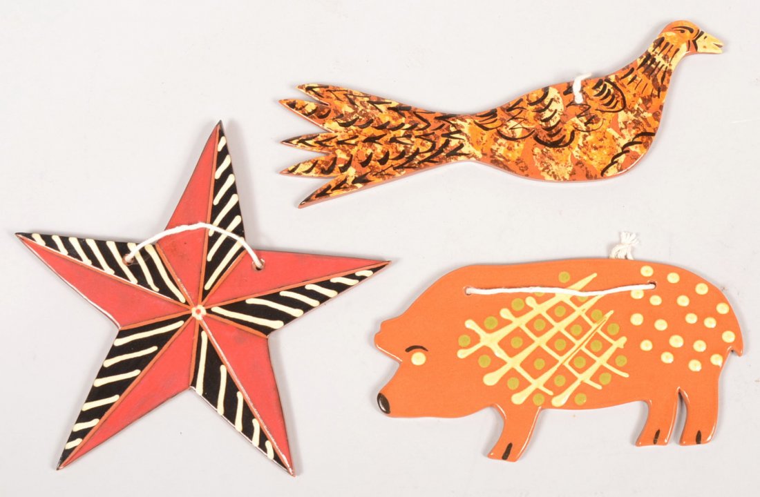 Three Redware Hanging Slip Decorated Slab Figures.: Three Redware Hanging Slip Decorated Slab Figures. A five point star, 2011, 7 1/2"dia.; a pig with yellow and green designs, 2011, 7 1/4"w.; a bird with scrambled orange, yellow and brown slip decorat