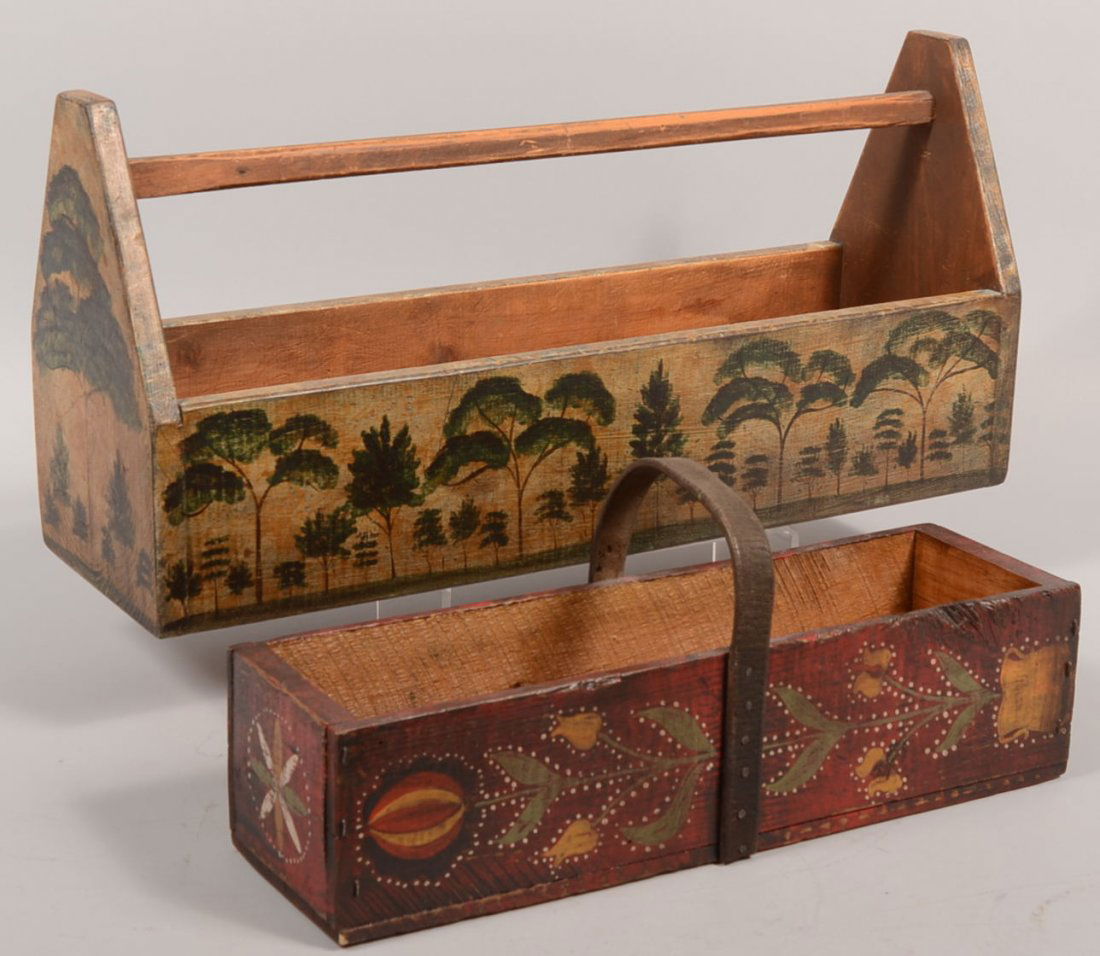 Two Kathy Graybill Painted Folk Art Tool Carriers.: Two Kathy Graybill Painted Folk Art Tool Carriers. Larger box painted with trees, a la: Rufus Porter, with length wise wood bar handle. 12"h. X 25 1/4"l. Along with a smaller carrier in red and bearin