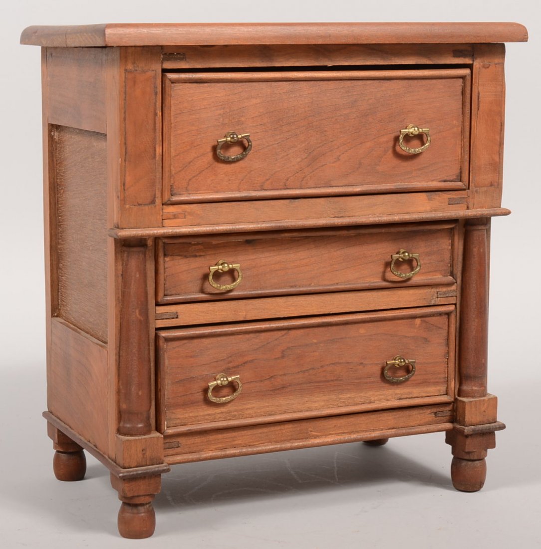 Contemporary Empire Chest of Drawers Model. One lar: Contemporary Empire Chest of Drawers Model. One large deep drawer over two graduated lower drawers, all with brass drop pulls. Half round columns on front, cockbeaded drawers, single recessed side pan