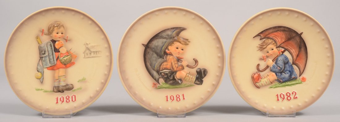 Three Hummel Annual Plates,1980, 1981, 1982. 1980 : Three Hummel Annual Plates,1980, 1981, 1982. 1980 back marks include: Hum 273, TMK-6, 1972. 7 1/2"dia. 1981 back marks include: Hum 274, Umbrella Boy, TMK-6, 1973. 1979 back marks include: Hum 275, Um