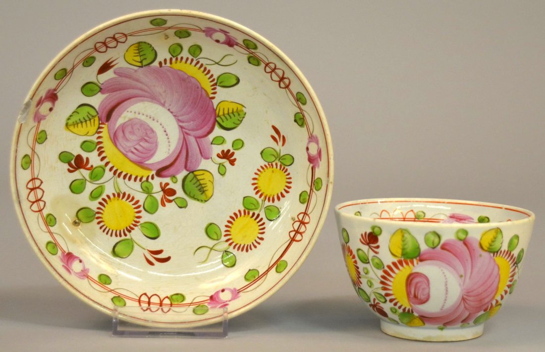 Pink Queen's Rose Paste Cup and Saucer. Handless c: Pink Queen's Rose Paste Cup and Saucer. Handless cup has one large rose with daisies. Saucer with the same decorations and a rose chain on inside rim. Leeds blue cast glaze build-up in crevasses. 2 1/