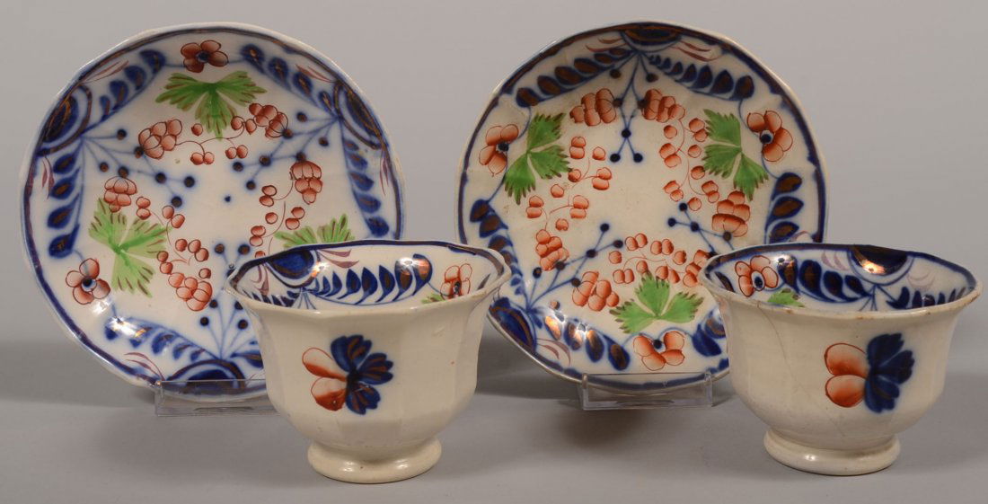 Two Fourteen Sided Gaudy Welsh Cup & Saucer. Match: Two Fourteen Sided Gaudy Welsh Cup & Saucer. Matching previous lot pattern. Footed handless cups with deep dished saucers. 2 3/4"h. X 5 7/8"dia.