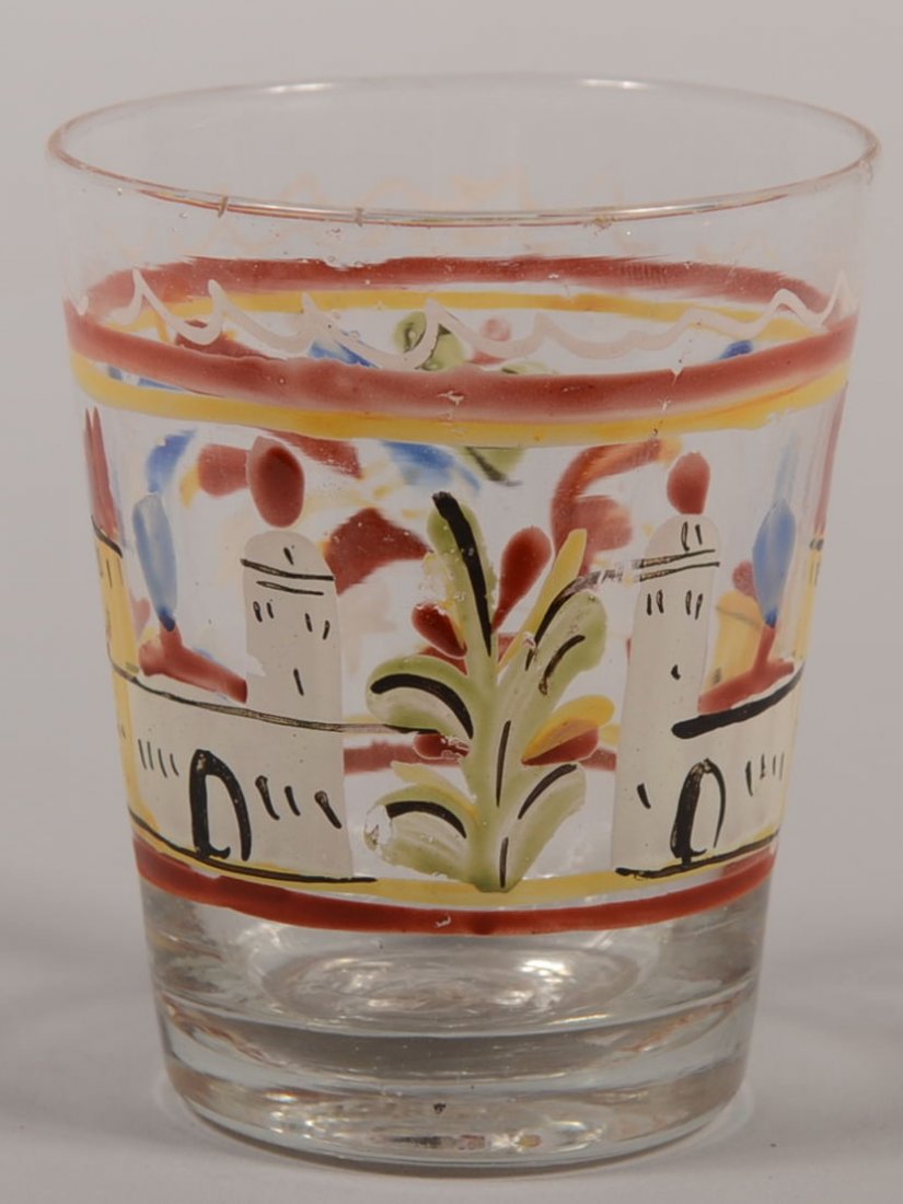 Small Paint Decorated Handless Drinking Glass. Red: Small Paint Decorated Handless Drinking Glass. Red, yellow, green, black, white and blue painted temples and buildings with floral sprays and circular lines. Broken pontil. 3"h.