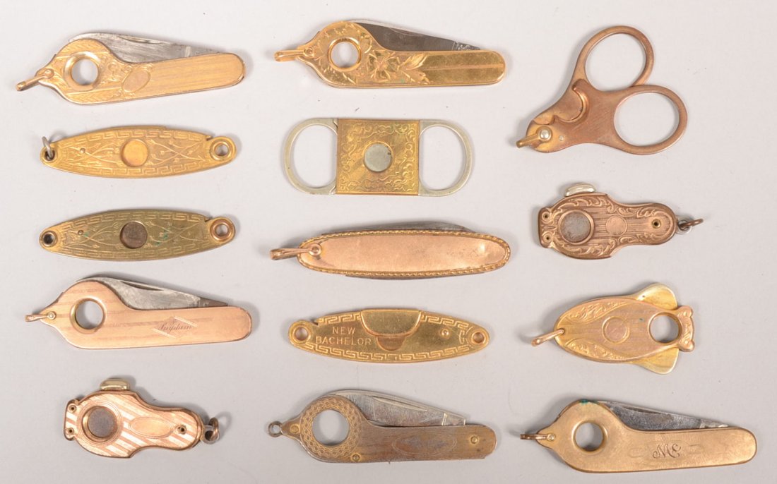 Fourteen Assorted Cigar Tip Cutters. One marked: ": Fourteen Assorted Cigar Tip Cutters. One marked: "Gold Topped." Others gold plated or gold colored brass. 1 1/2"l. to 2 3/8"l.