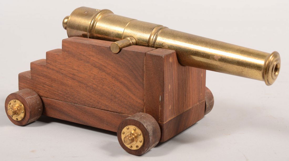 Brass Cannon Barrel on Walnut Naval Carriage. Hand: Brass Cannon Barrel on Walnut Naval Carriage. Hand made model with stepped walnut carriage and four walnut wheels on brass axles. Brass barrel turned like a Parrot gun and without trunnion caps. 9 1/4