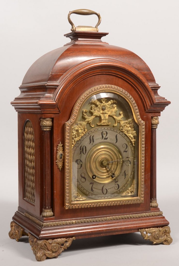 Tiffany & Co. Marked Mahogany Shelf Clock. Chapter: Tiffany & Co. Marked Mahogany Shelf Clock. Chapter ring has black wax filled incised Arabic numbers and is marked:" Tiffany & Co., Makers." Domed mahogany case features cast brass ormolu: bracketed fe