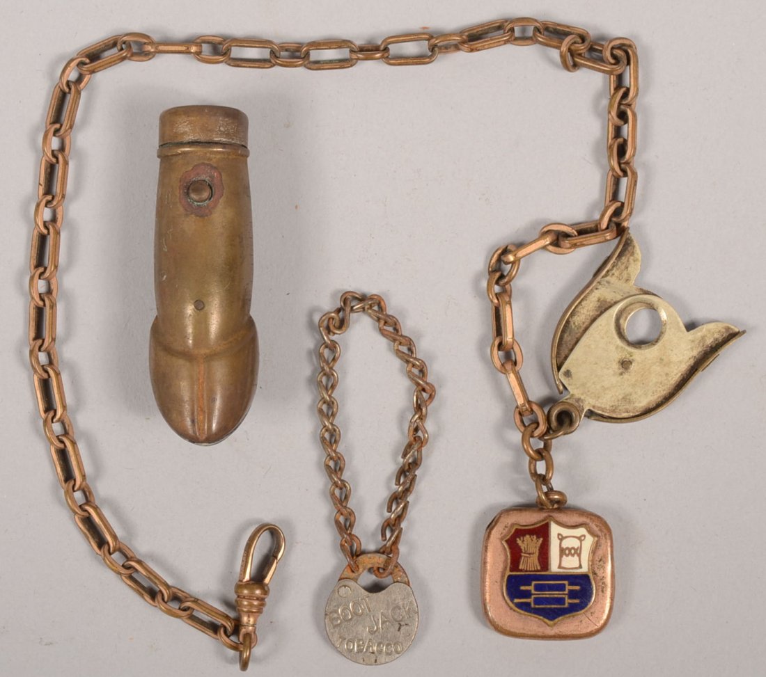 Three Tobacco Use Related Objects. A formed brass : Three Tobacco Use Related Objects. A formed brass hoof shaped match safe with hinged cover, 2 1/4"l. A gold plated watch chain with gold plated fob having an enameled coat of arms and a brass and nick