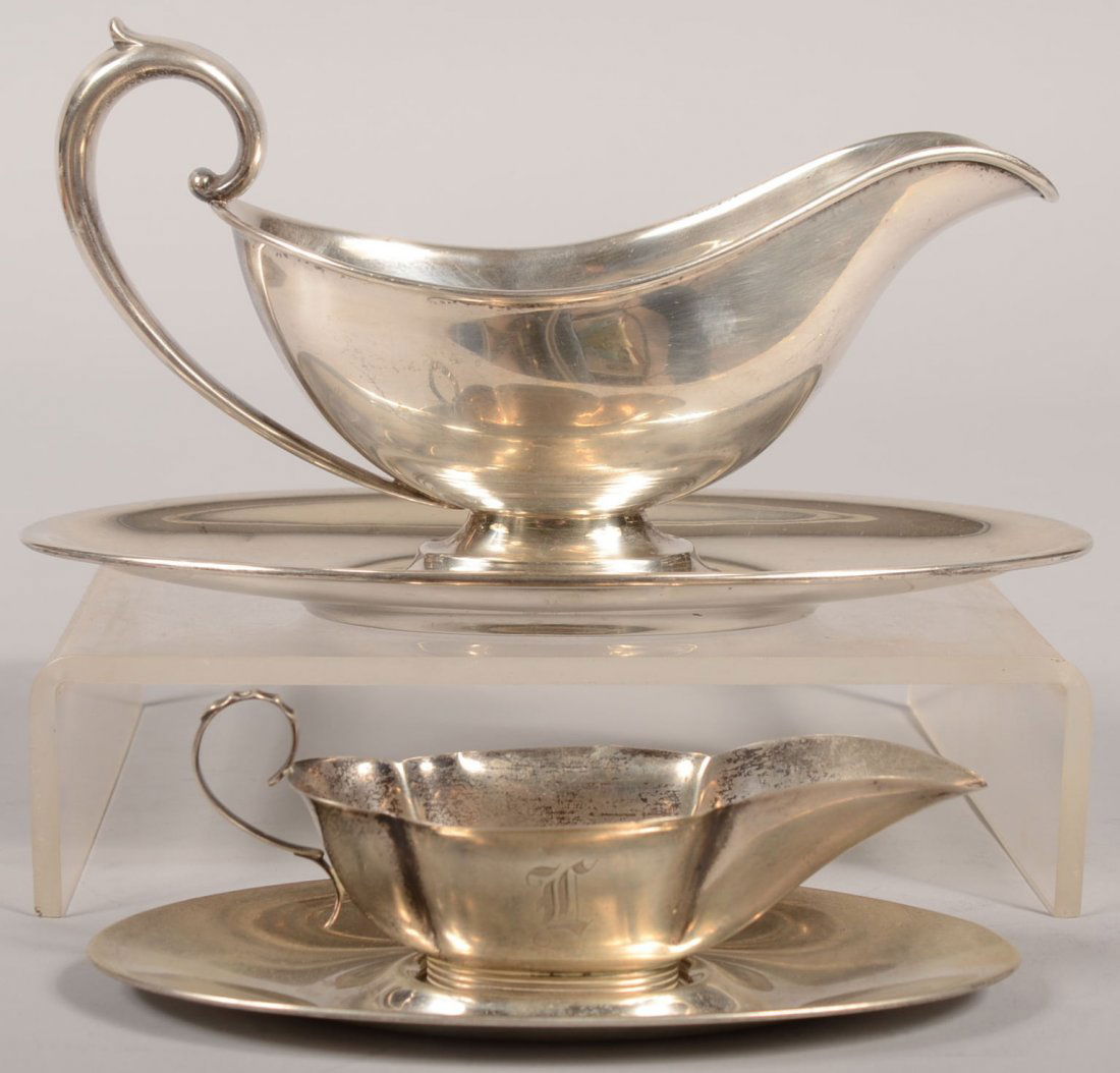 Two Sterling Sauce Boats with Trays. A set marked: Two Sterling Sauce Boats with Trays. A set marked Gorham and along with standard touch marks there is a zeppelin image struck on each. Boat with applied loop handle and stepped foot, 7 5/8"l. and oval