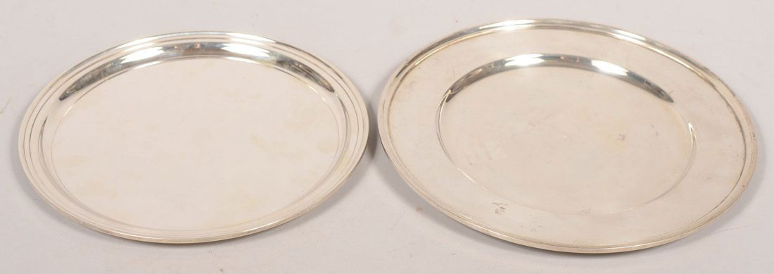 Two Round Sterling Bar Trays. Smaller marked: "Tif: Two Round Sterling Bar Trays. Smaller marked: "Tiffany & Co.", 10"dia. Along with another with a wider rim, "S. Kirk & Son", 11" dia. Total weight: 35.2 ozt.