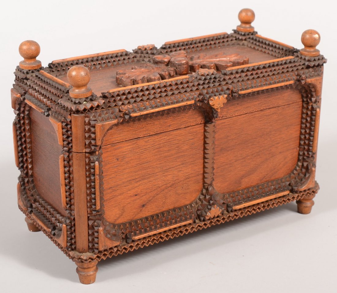 Chip Carved Tramp Art Style Dresser Box. Single an: Chip Carved Tramp Art Style Dresser Box. Single and double carved strips frame the flat walnut panels. Top lid and base have turned knobs as feet and finials. Center of lid has carved and applied oak 