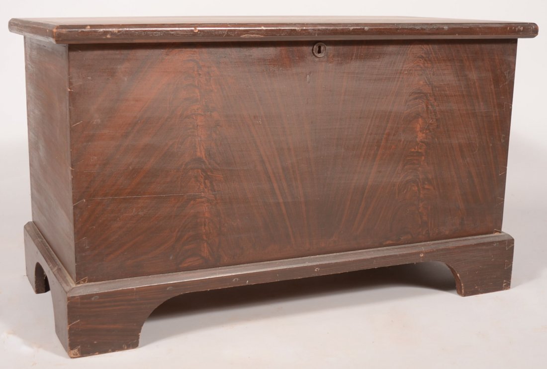 Brown Faux Grained Poplar Blanket Chest. Simple da: Brown Faux Grained Poplar Blanket Chest. Simple dark brown graining overall with bracket foot base and butt hinged lid with lock and hasp, but no key. Interior till has lid and additional shelf. 22 1/