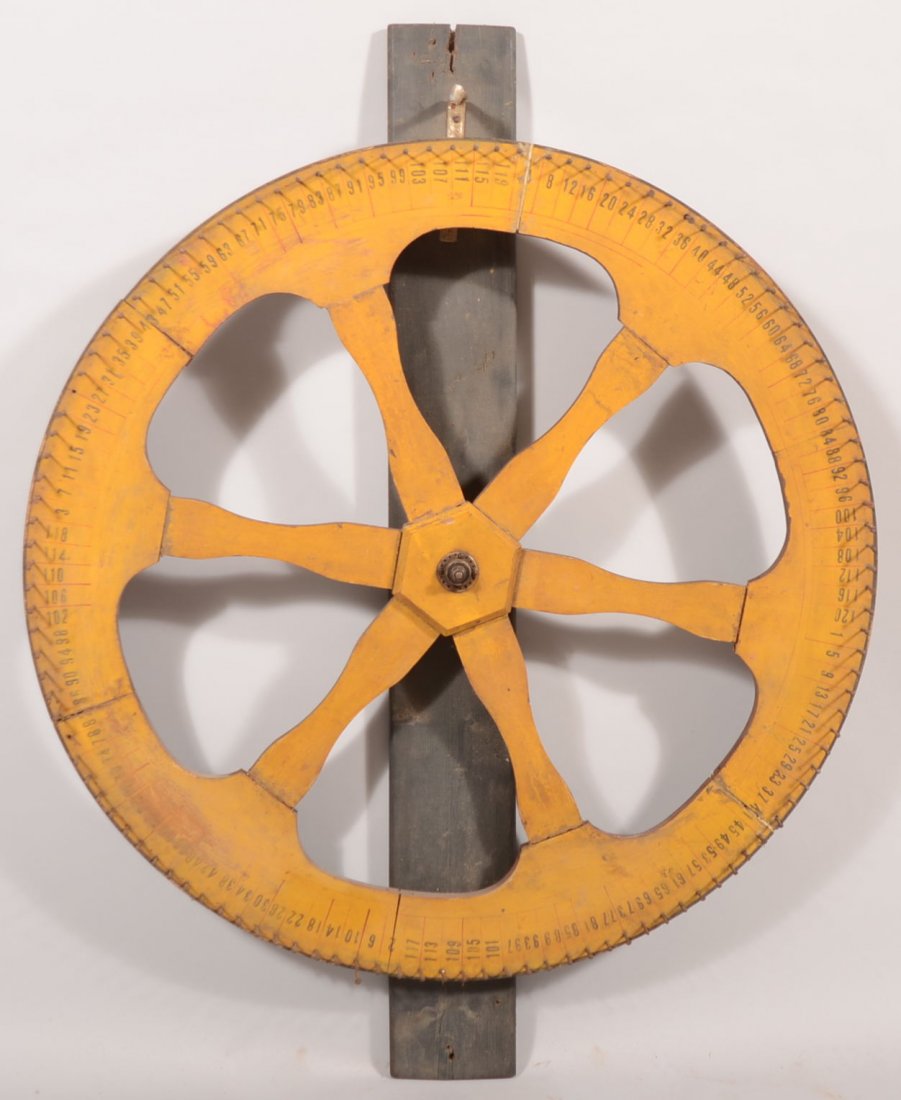 Large Yellow Painted Wood Gaming Wheel. Six spoke,: Large Yellow Painted Wood Gaming Wheel. Six spoke, six section painted wood wheel with numbers and metal pins revolve around a steel spindle that bolts to a strip ticker support. 36 1/2"dia.