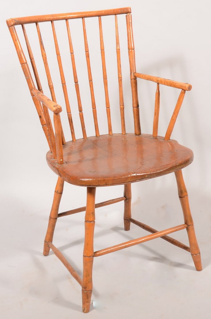 Windsor Armchair with Bamboo Turnings. Seven spind: Windsor Armchair with Bamboo Turnings. Seven spindle back with spindles through the top rail. Right angle arms with one support spindle, plank seat with carved gutter and through seat leg ends, four b