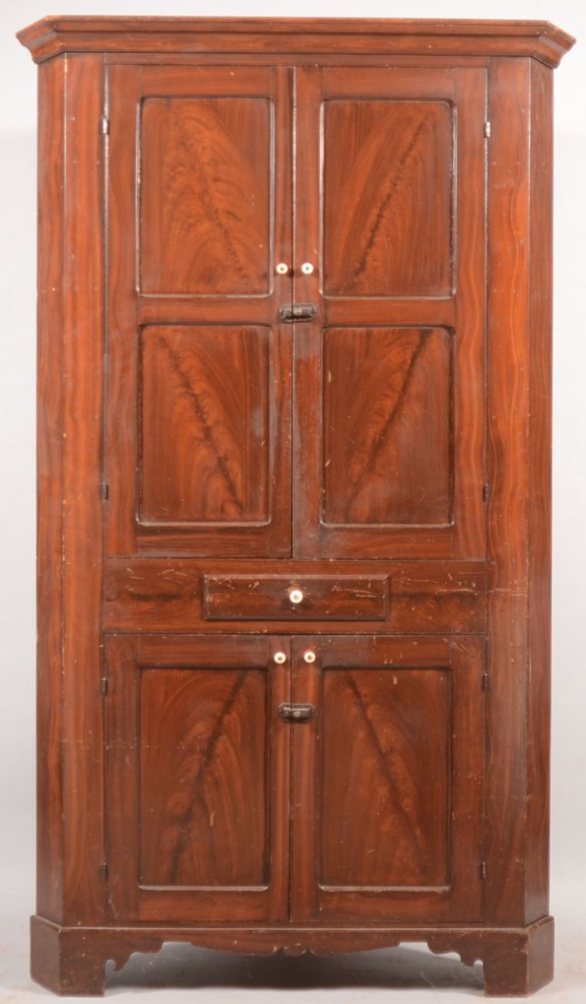 One Piece Painted Softwood Corner Cupboard. Probab: One Piece Painted Softwood Corner Cupboard. Probably Lancaster County, PA. Applied cornice molding over two double recessed paneled doors, a small mid drawer and two single recessed paneled lower door