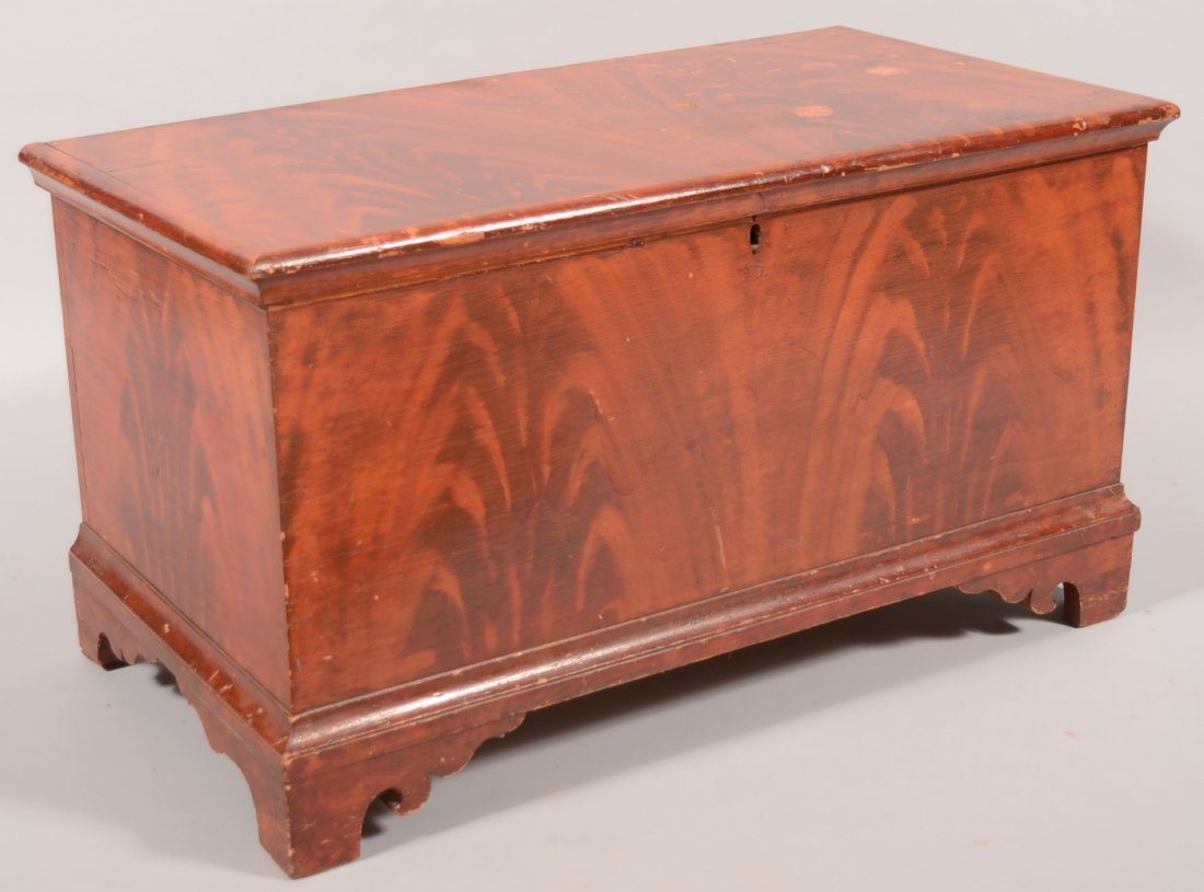 John Rupp Paint Decorated Softwood Blanket Chest. : John Rupp Paint Decorated Softwood Blanket Chest. Red on pink faux mahogany crotch graining on front, sides and butt hinged lid. Box rests on flat faced bracket feet. Interior is fitted with left and 