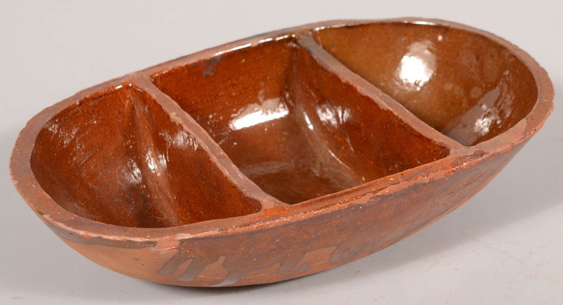 Divided Oblong Redware Service Bowl. Oblong bowl h: Divided Oblong Redware Service Bowl. Oblong bowl has two slab dividers creating three compartments. Interior salt glazed with some slop over. 3"h. X 12"l. X 7 3/8"w.