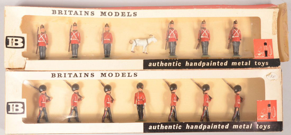 Two Boxes of W. Britain Painted Cast Soldiers. Two: Two Boxes of W. Britain Painted Cast Soldiers. Two original cellophane window boxes, with soldiers tied in. #9158, Canada, Fort Henry Guards. Six soldiers with a goat mascot. Along with another box of