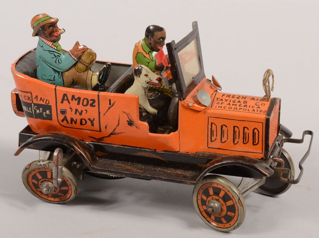 Amos 'n Andy Fresh Air Taxi Cab Wind-up Toy. Mfg. : Amos 'n Andy Fresh Air Taxi Cab Wind-up Toy. Mfg. by Louis Marx & Co. Lithographed tin action vehicle with driver, passenger and dog. Orange body , black fenders with profuse illustration. 5"h. X 7 1/
