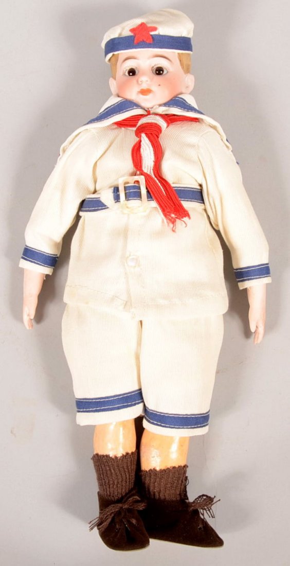 Porcelain Head Sailor Boy Doll. Gauze covered sawd: Porcelain Head Sailor Boy Doll. Gauze covered sawdust body, arms and legs to first joint. Porcelain forearms and hands. Composite legs from knees. Blue trimmed white coat, short pants and hat, red and