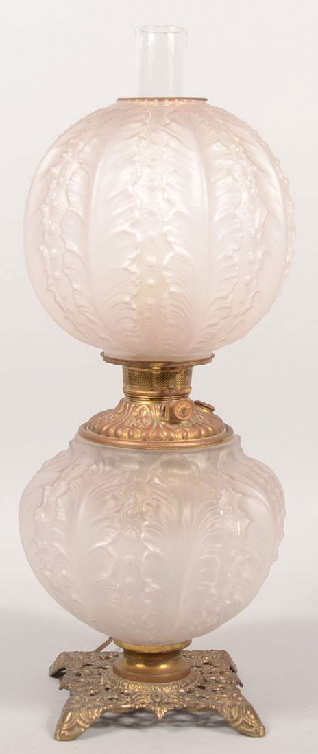 Victorian Double Frosted Globe Oil Lamp. Square re: Victorian Double Frosted Globe Oil Lamp. Square reticulated and footed cast brass base supports a feather relief pattern frosted glass bottom sphere having an inset brass font with burner(electrified)