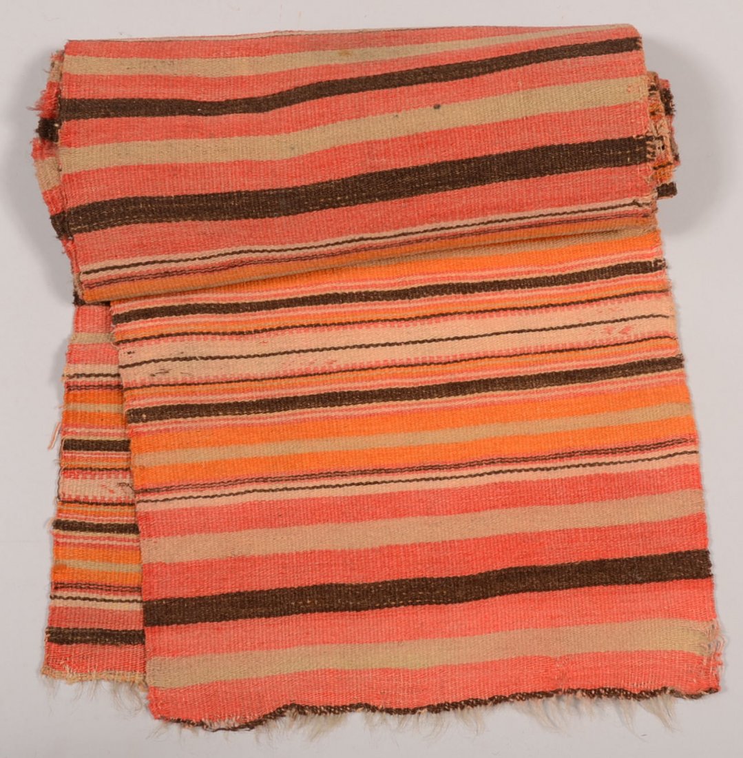 Two Pieces of Middle Eastern Woven Fabric. Horizon: Two Pieces of Middle Eastern Woven Fabric. Horizontally striped goat hair naturally dyed in shades of red and brown with natural color. Some geometric designs. Were probably once seamed together. 73"l