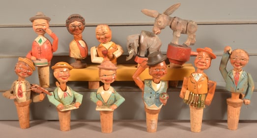 11 Italian Hand-Carved Figural Bottle Stoppers.