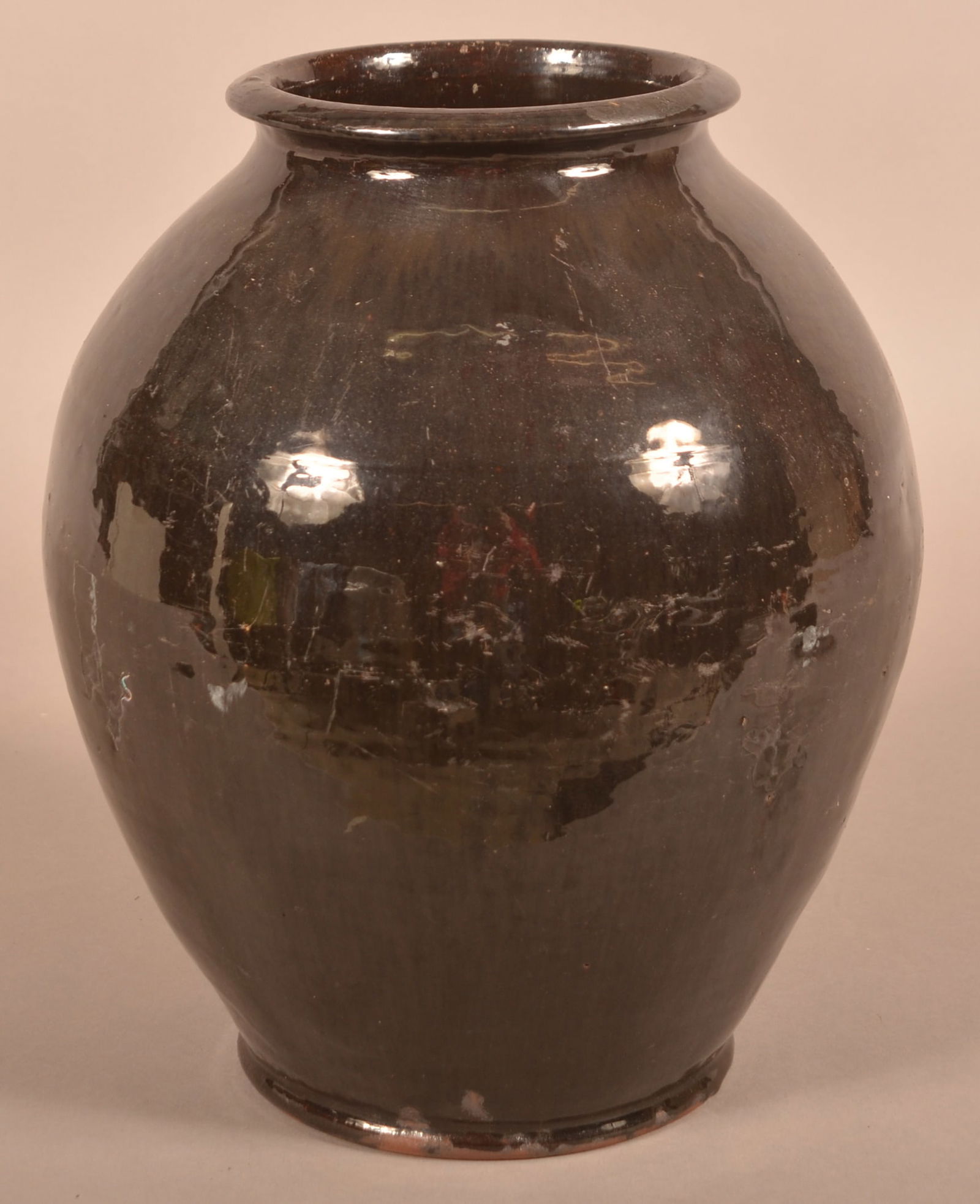 19th C. Manganese Glazed Redware Storage Jar.: Large 19th Century Manganese Glazed Redware Storage Jar. Flared, molded rim and bulbous body. 12-1/2"h.