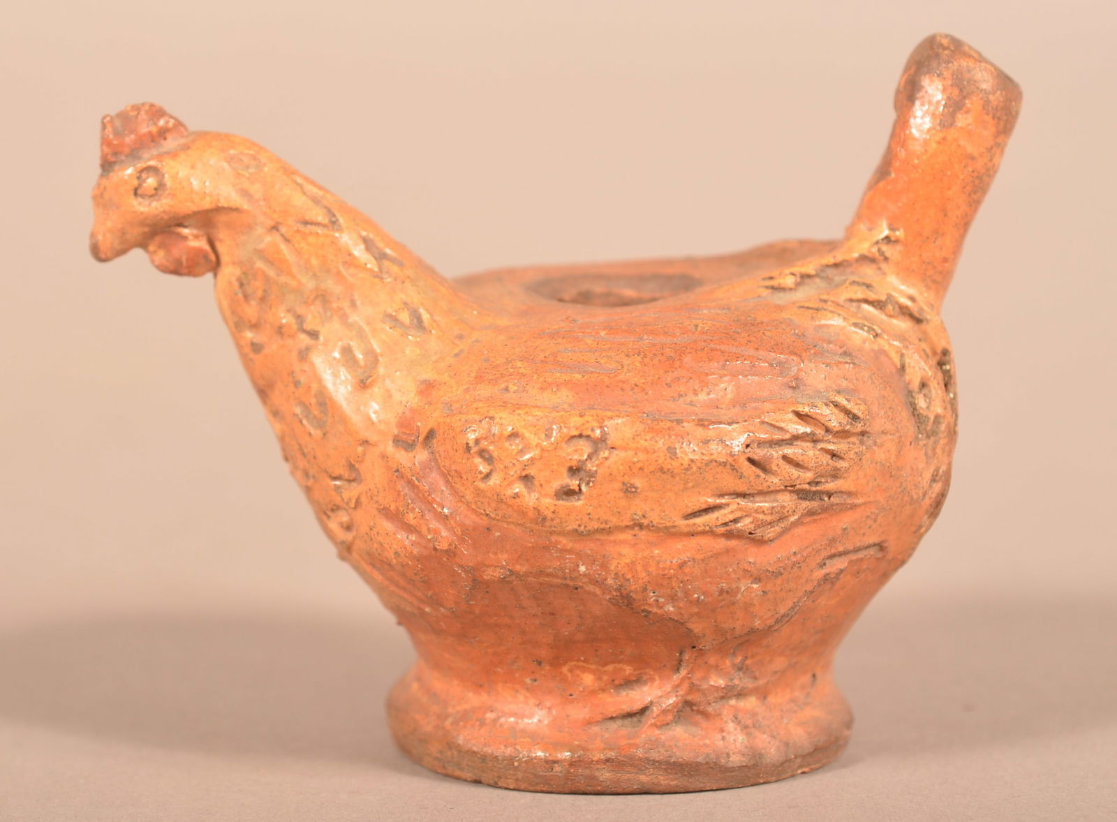 PA 19th Century Redware Hen-Form Whistle.: Pennsylvania 19th Century Redware Hen-Form Whistle. Incised signature on base "M.H. Bergy". Provenance: Titus Geesey. 3''h.