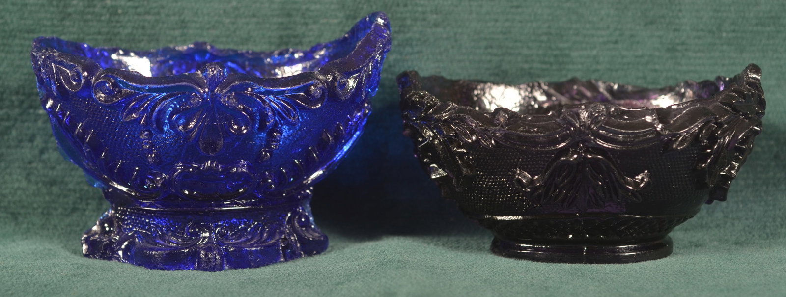 Two Lacy Pressed Sandwich Glass Salts.: Two Lacy Pressed Sandwich Glass Salts. Amethyst and cobalt blue. 3-1/2"w.