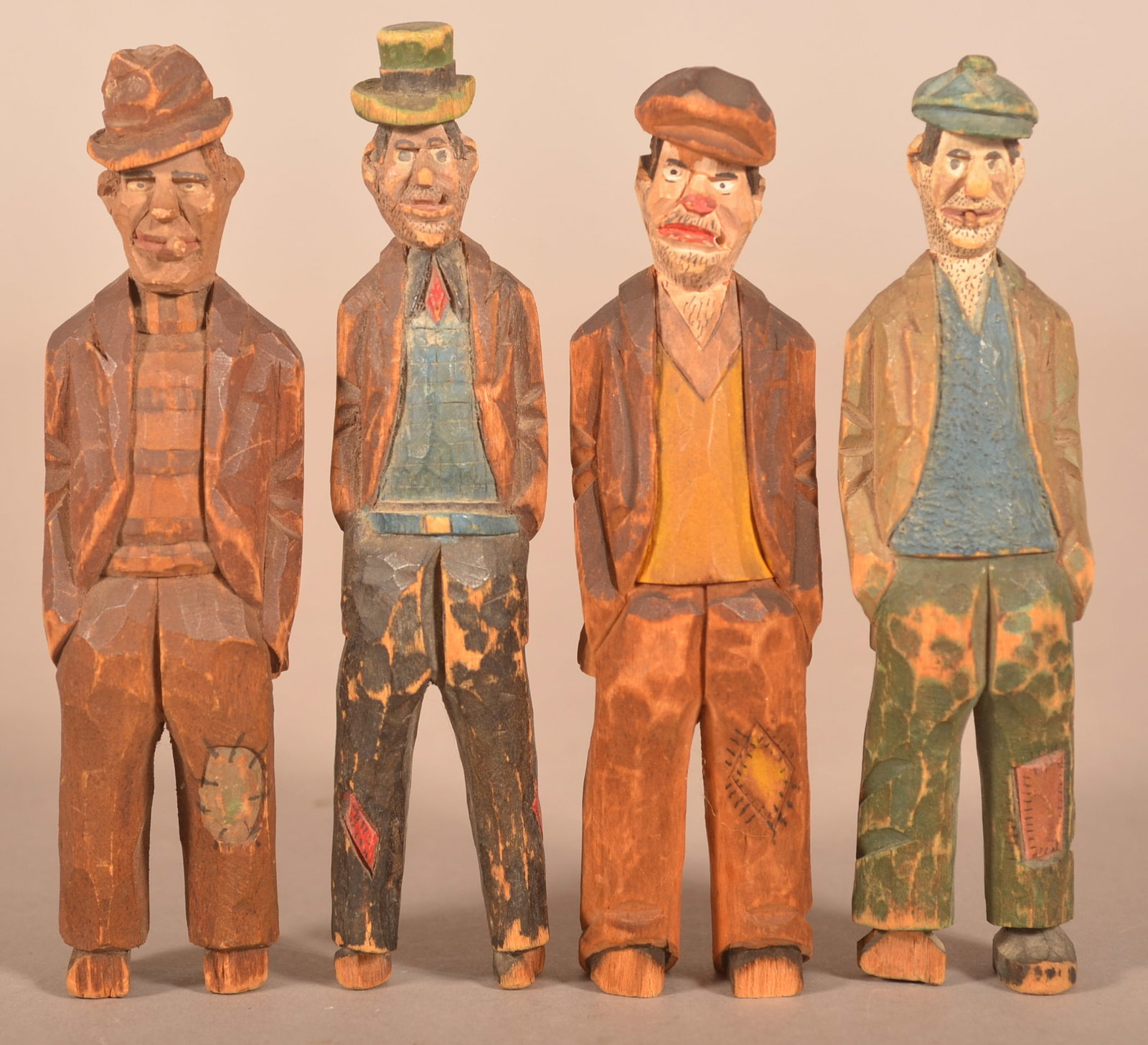Four Jail Carvers Hobo Folk Art Figures.: Four Folk Art Carved and Painted Wood Hobo Figures. Attributed to the Jail Carvers. Tallest measures 5-3/4"h.