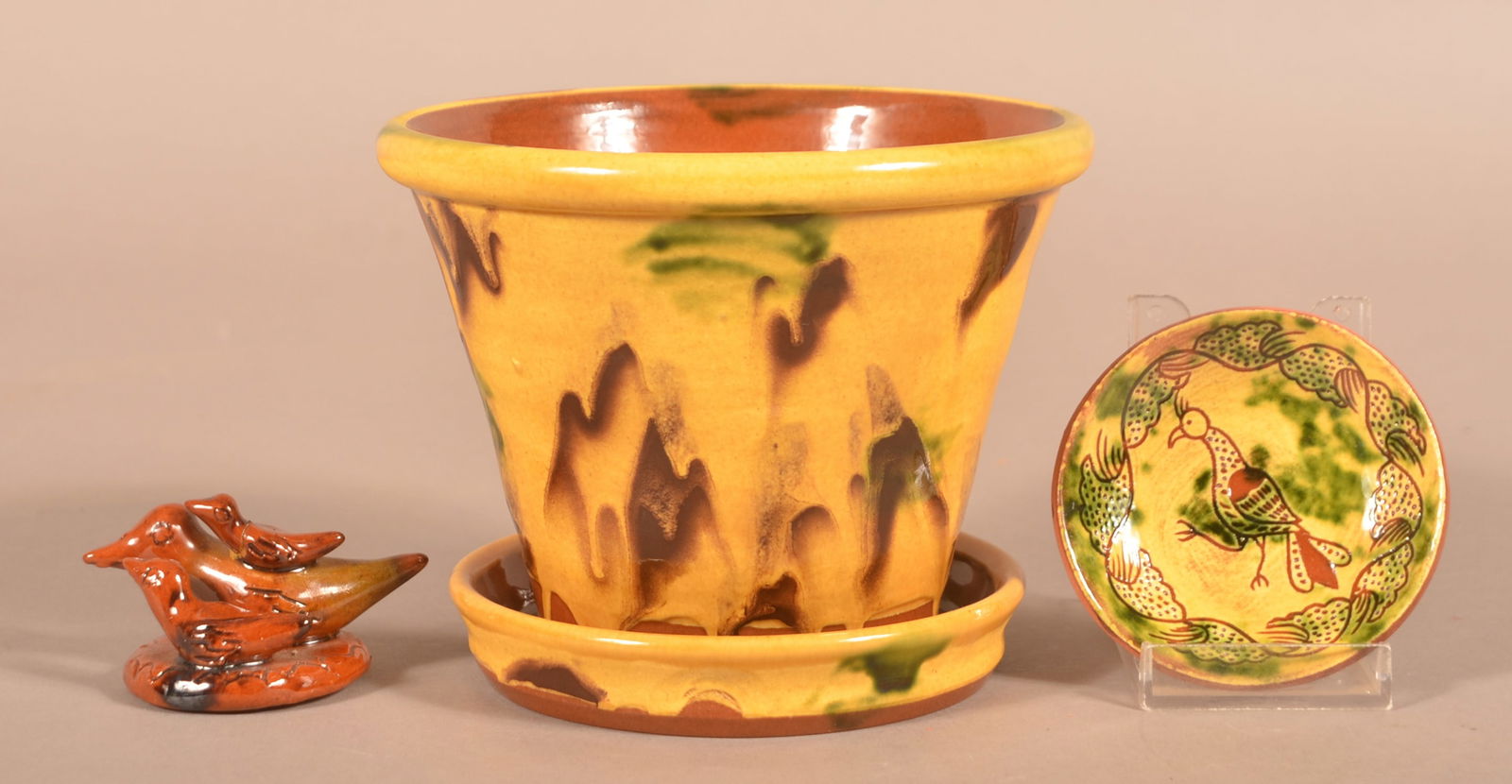 Three Pieces of Breininger Glazed Redware Pottery.: Three Pieces of Breininger Glazed Redware Pottery. Planter dated 2008, 4-3/4"h., Sgraffito miniature plate dated 1991, and a miniature bird group dated 1978.