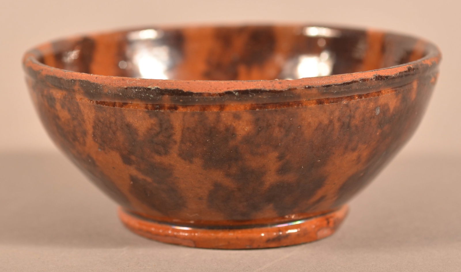 PA 19th C. Mottle-Glazed Redware Miniature Bowl.: Pennsylvania 19th Century Mottle-Glazed Redware Miniature Bowl. Molded rim and base. Provenance: The late Eugene and Vera Charles, Lancaster, PA. 1-1/2'h. x 3-5/8" diam.