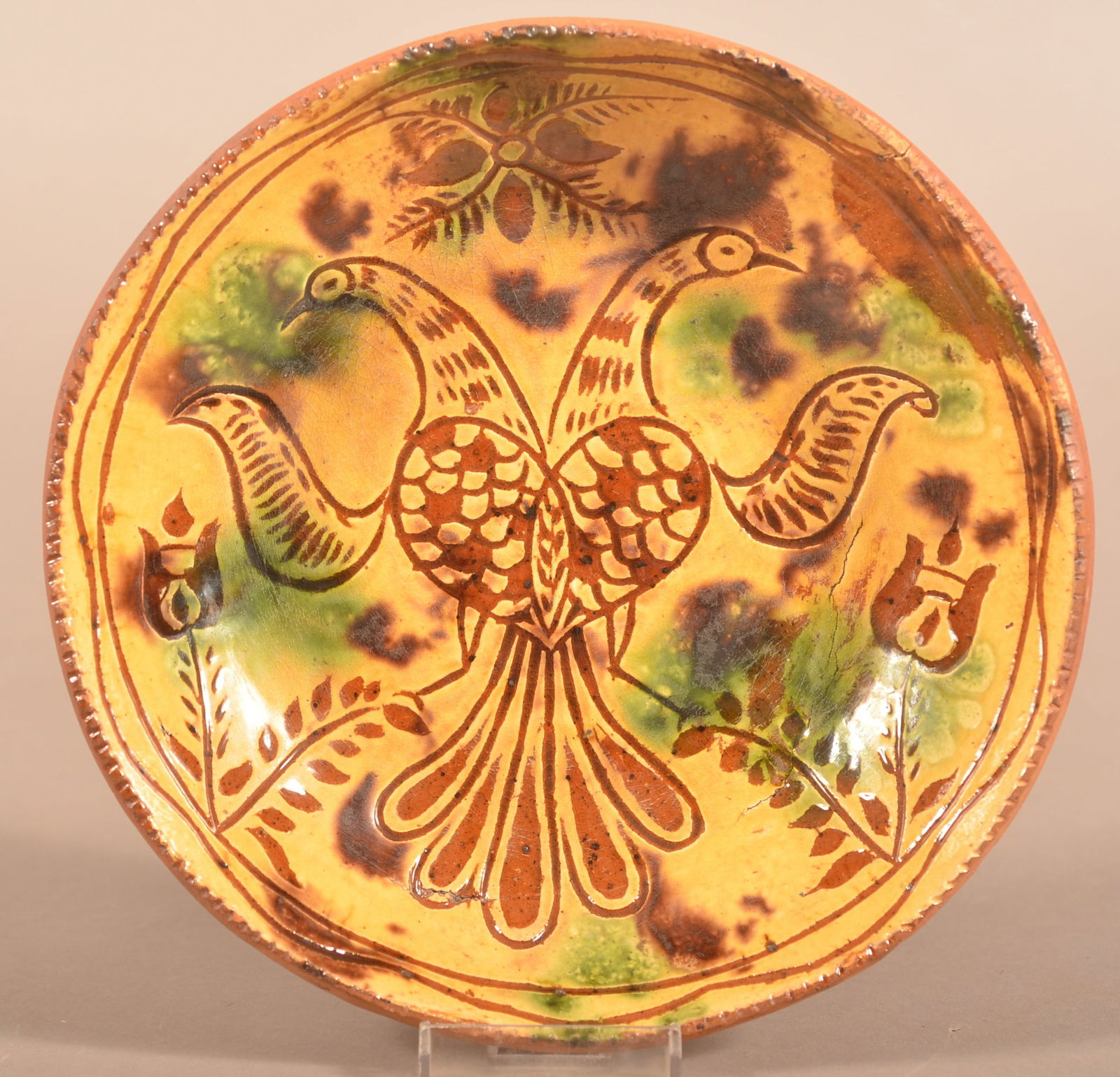 Redware Sgraffito Plate Attrib. to Jacob Medinger.: Sgraffito-Decorated Redware Plate Attributed to Jacob Medinger. Limerick Township, Montgomery County, PA, circa 1880-1930. Incised with a double distelfink design. Yellow ground glaze with green and b