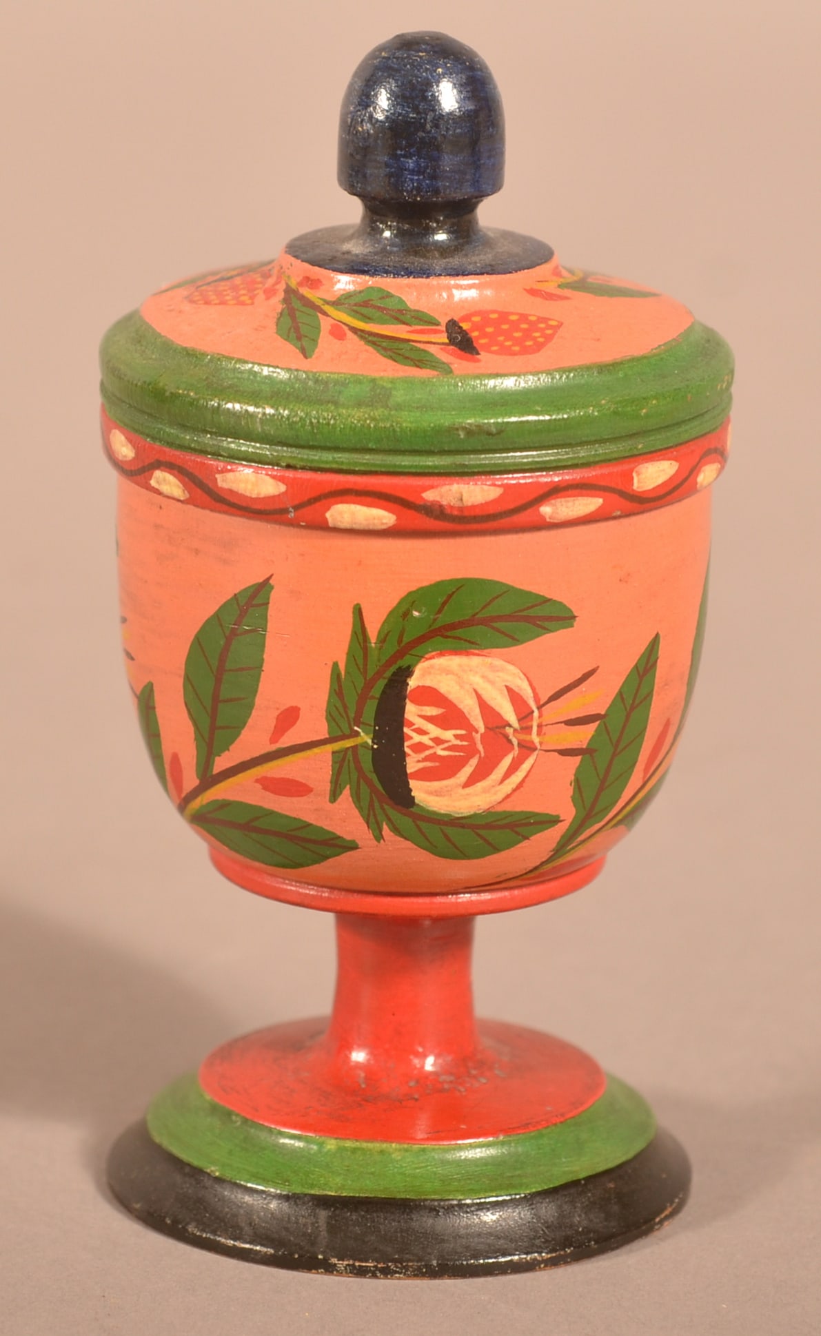 Covered Lehnware Footed Saffron Cup.: Covered Lehnware Footed Saffron Cup. Joseph Long Lehn (1798-1892), Clay Township, Lancaster County, Pennsylvania. Turned poplar wood, red, green and blue pedestal base, salmon body with pomegranates,