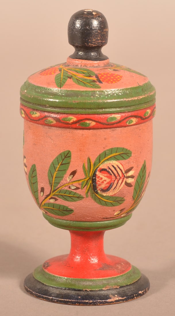 Covered Lehnware Footed Saffron Cup.: Covered Lehnware Footed Saffron Cup. Joseph Long Lehn (1798-1892), Clay Township, Lancaster County, Pennsylvania. Turned poplar wood, red, green and blue pedestal base, salmon body with pomegranates,