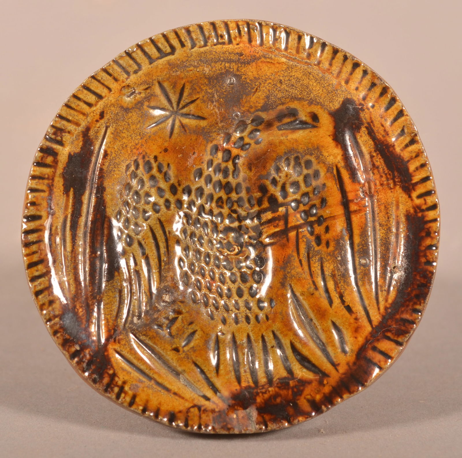 Mottle-Glazed Redware Eagle Butter Print. (1 of 3)