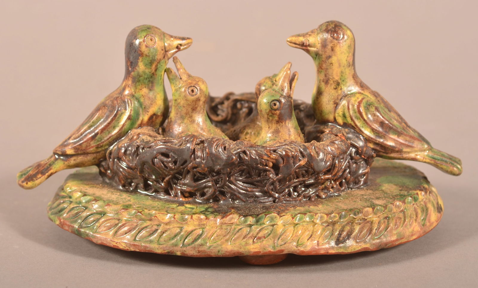 Antique Birds-in-Nest Redware Figural Group.: Antique Birds-in-Nest Redware Figural Group. Yellow, green and manganese glaze. Provenance: The late Jan Paden, Duncannon, PA. 4"h. x 7-1/2"w.
