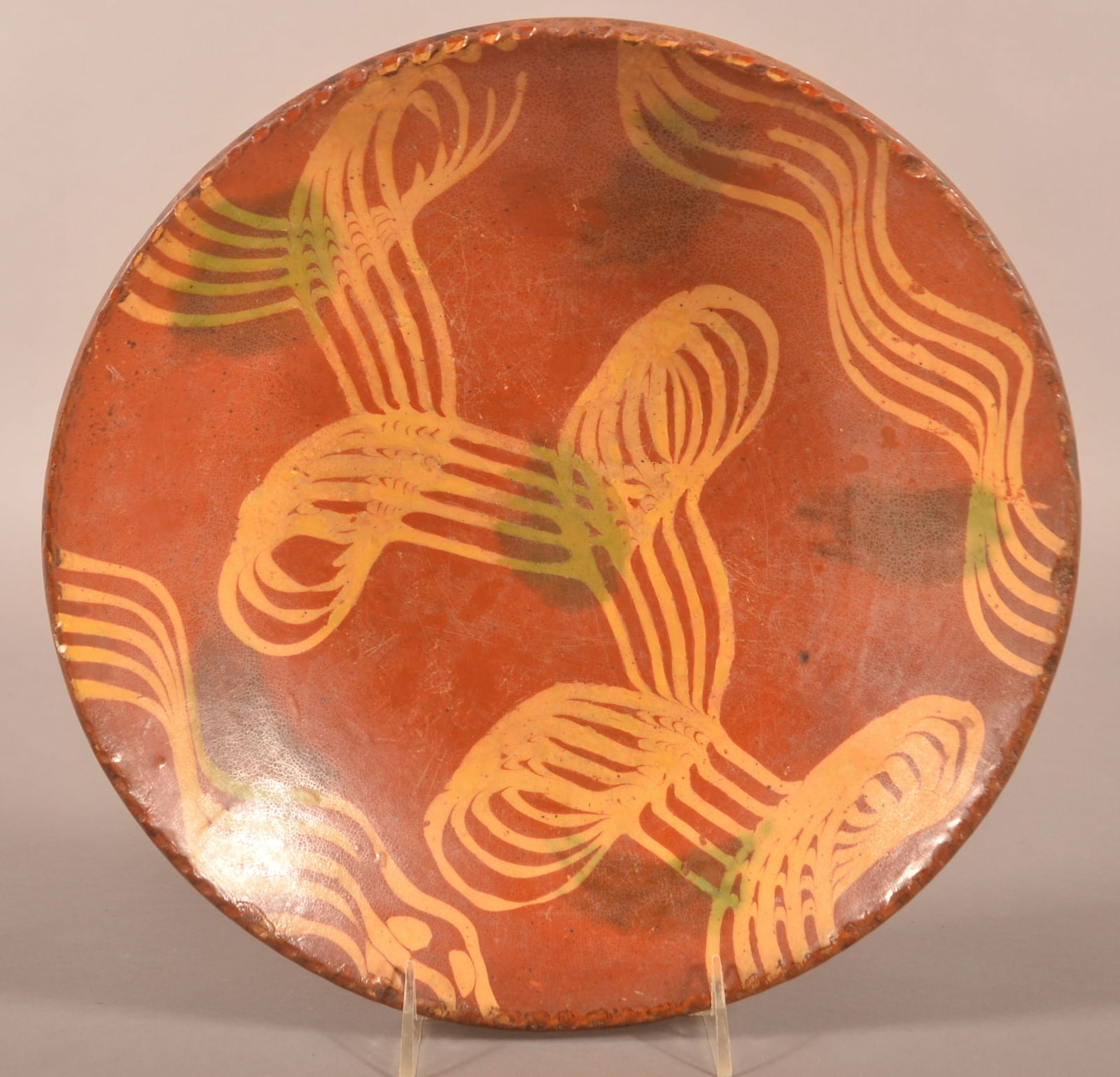 Redware 19th Century Slip-Decorated Charger.: Redware 19th Century Slip-Decorated Charger. Combed yellow slip with green daub decoration. Provenance: The late Jan Paden, Duncannon, PA. 12'' diam.