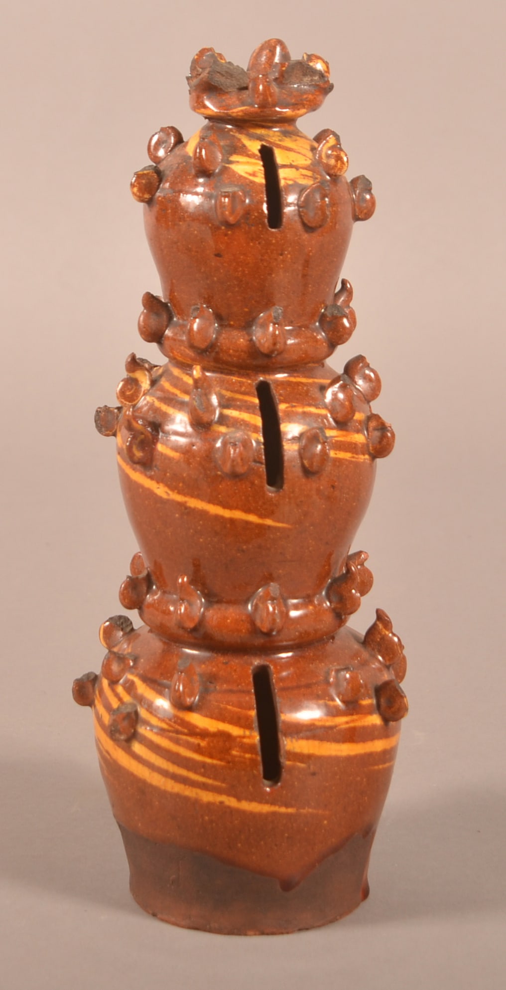 English Scroddleware Pottery Dome-Form Still Bank.: English Scroddleware Pottery Dome-Form Still Bank. Mid-19th century. Glazed redware triple-tier graduated bank. Provenance: The late Jan Paden, Duncannon, PA. 11"h.