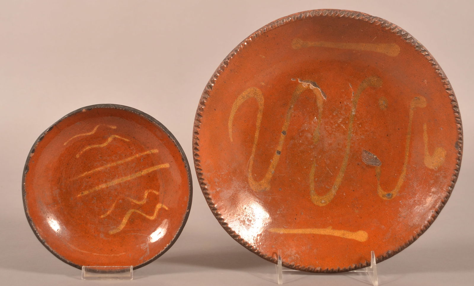 Two 19th Century Slip-Decorated Redware Plates. (1 of 3)